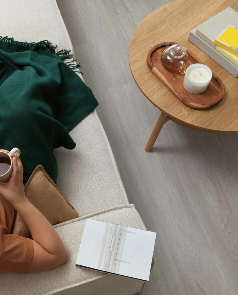 Lifestyle image from overhead showing vinyl floor boards interior campaign photography.